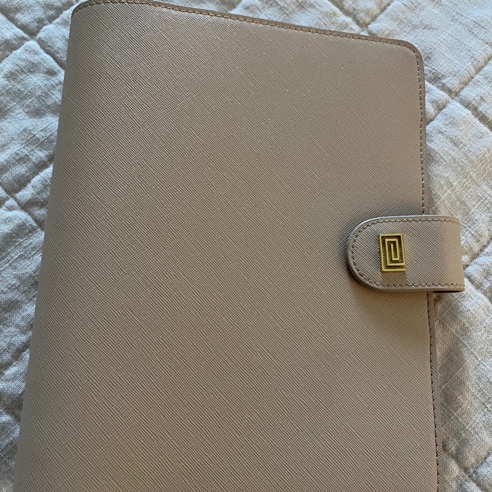 Beautiful Notiq planner cover and discs